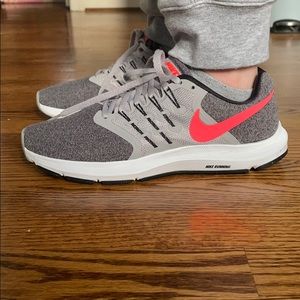 Pink and grey Nike running shoes